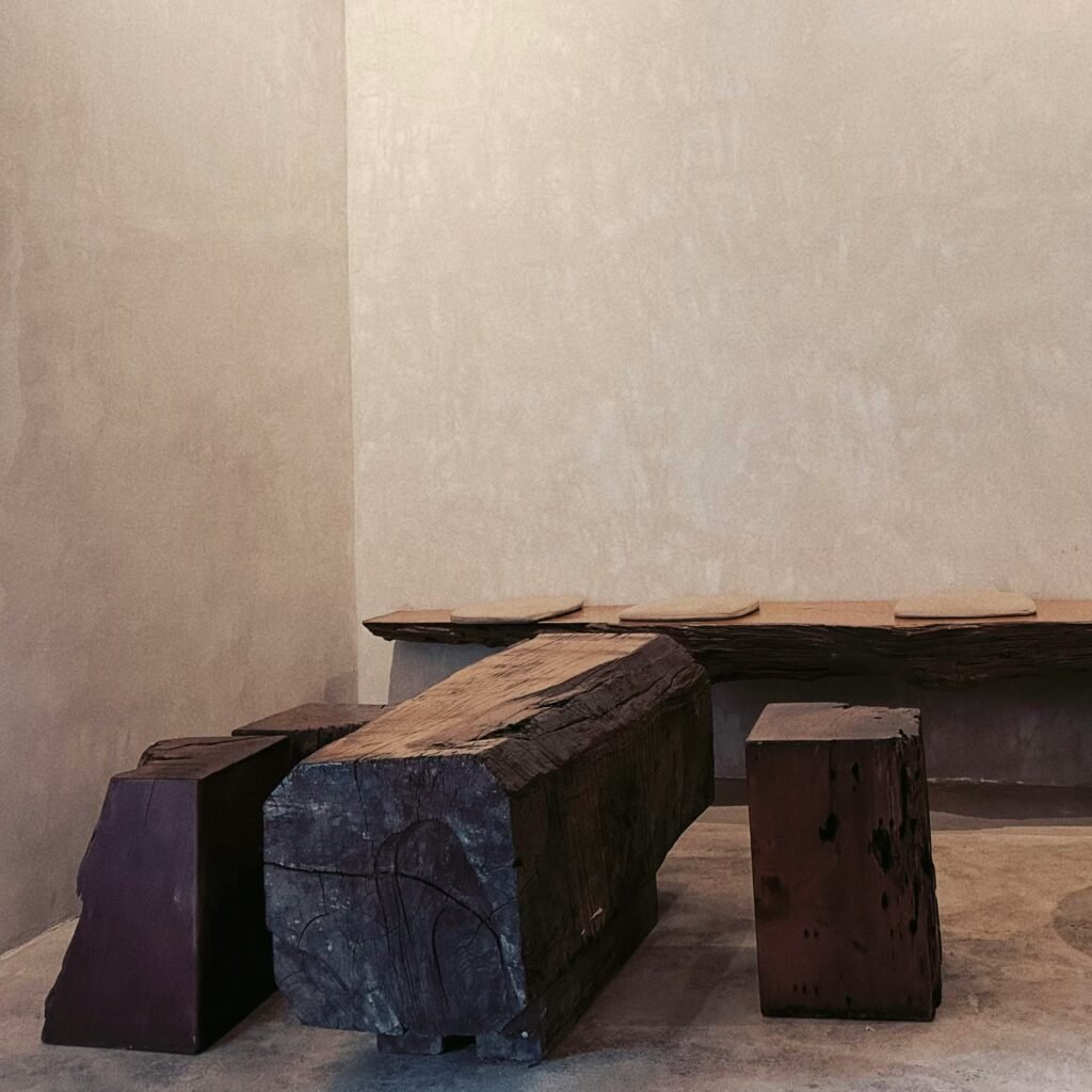a wooden bench and benches in a room