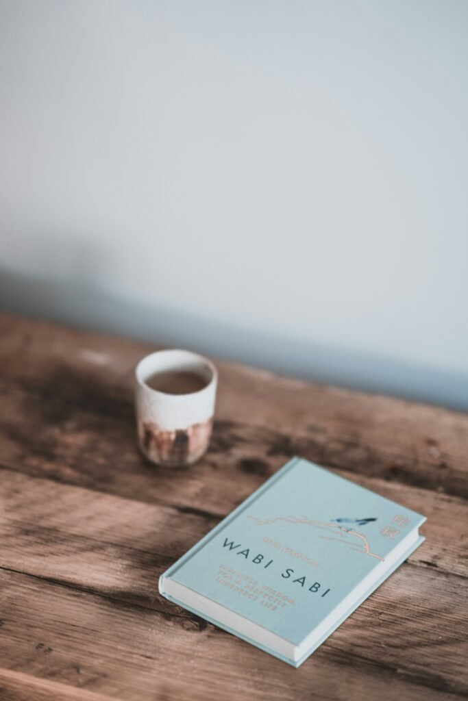 Wabi Sabi book and a cup on a table